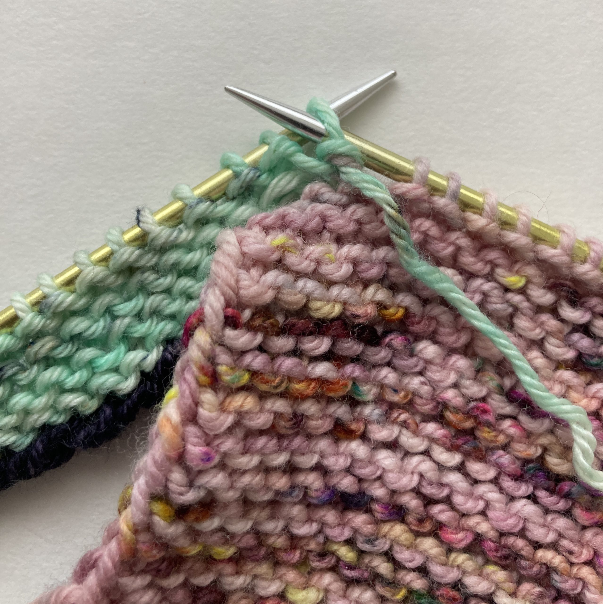(RS) at start of row. SL1WYIF from working stitches (green) on needle.